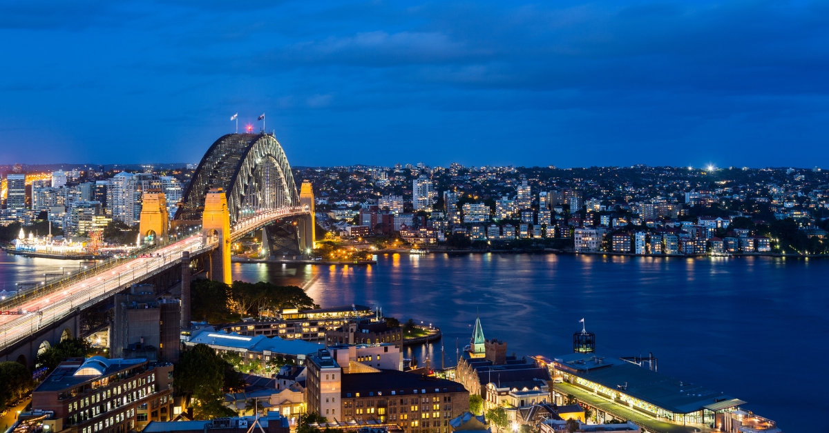 Sydney Harbour city lights at night from a private yacht